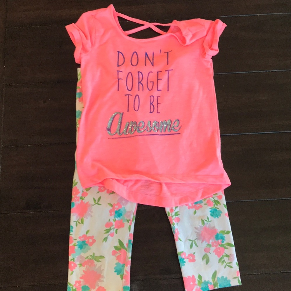A bundle of a girls shirt and capri leggings
